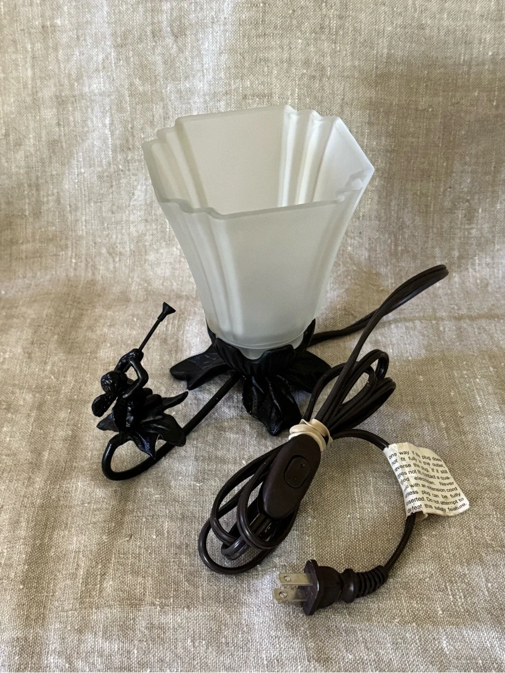 Vintage style cast metal cherub lamp
